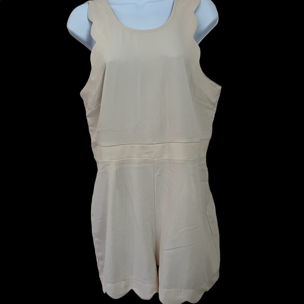 Darling Romper with soft tulip edge leg,a zip back.